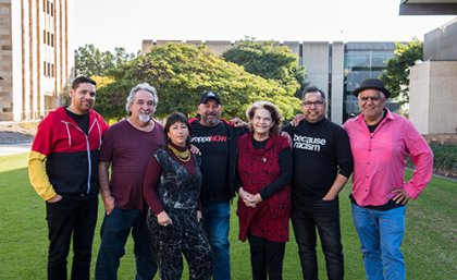 Aboriginal and Torres Strait Islander audiences are advised that the following may contain images, names, and voices of people who have deceased. Permission has been granted from the family of Laurie Nilsen for all images and artwork to be shown here and in the exhibition. (L-R) Tony Albert, Laurie Nilsen, Megan Cope, Gordon Hookey, Jennifer Herd, Vernon Ah Kee, and Richard Bell. Photo: Lewis James Media, 2019. Tony Albert, Laurie Nilsen, Megan Cope, Gordon Hookey, Jennifer Herd, Vernon Ah Kee, and Richard Bell. Photo: Lewis James Media, 2019.